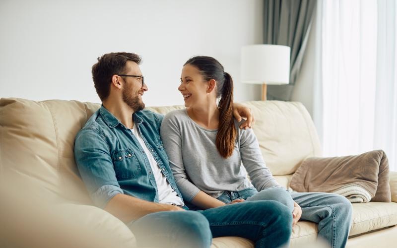 a man and a woman sitting on a couch